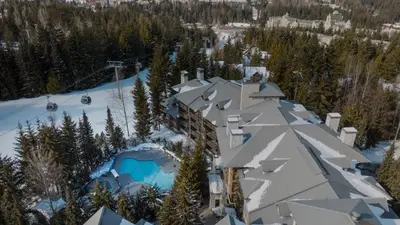 an aerial view of a ski lodge in the snow at Blackcomb Springs Suites by CLIQUE in Whistler
