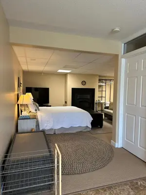 a large bedroom with a bed and a living room at 1st Choice Bed and Breakfast in Whitehorse