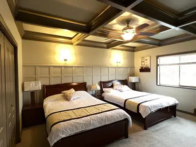 a bedroom with two beds and a ceiling at V.I.P. CLUB in Surrey