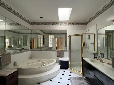 a large bathroom with a tub and a shower at V.I.P. CLUB in Surrey