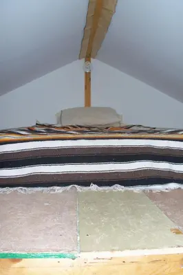 a unmade bed in a room with at Cabine, Home Sweet Home in Whitehorse