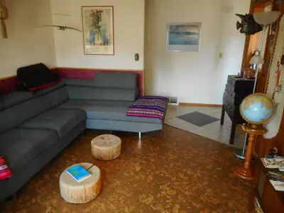 a living room with a couch and a table at Cabine, Home Sweet Home in Whitehorse