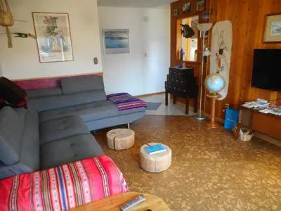 a living room with a couch and a tv at Cabine, Home Sweet Home in Whitehorse