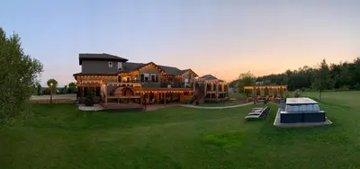 an aerial view of a large house with a yard at Dragonfly Inn Loft Suite in Sherwood Park