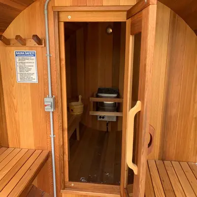 a door to a small room in a wooden boat at Dragonfly Inn Loft Suite in Sherwood Park