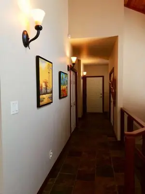 a hallway of a home with two pictures on the wall at High Hopes Bed and Breakfast in Hope