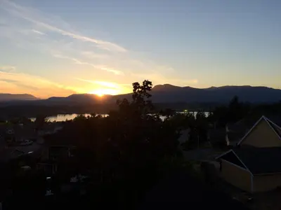 a view of the sunset from the roof of a house at Eaglenest Manor Cowichan in Duncan