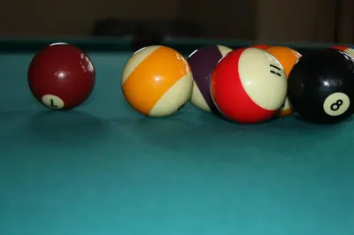 a group of billiard balls on a pool table at Eaglenest Manor Cowichan in Duncan