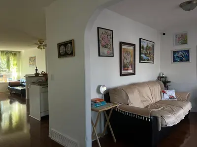 a living room with a couch and a table at Hidden valley treehouse home! in Calgary