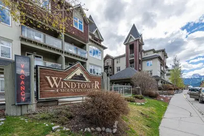 a sign in front of a building at WindTower Resort - 1 Bed Hotel Room 166 in Canmore