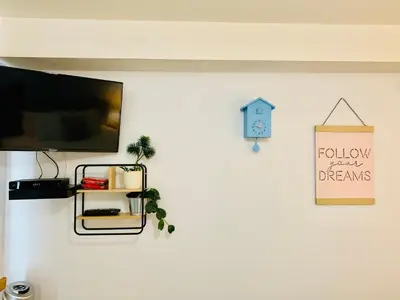 a white wall with a shelf and a sign on it at WindTower Resort - 1 Bed Hotel Room 166 in Canmore