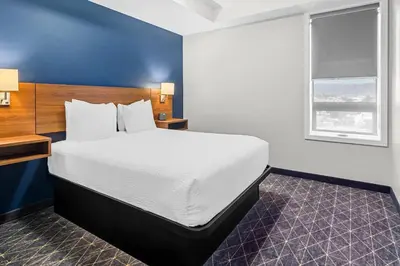 a hotel room with a bed and a window at Park Inn by Radisson, Kelowna in Kelowna