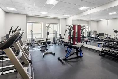 a gym with several treadmills and cardio machines at Park Inn by Radisson, Kelowna in Kelowna