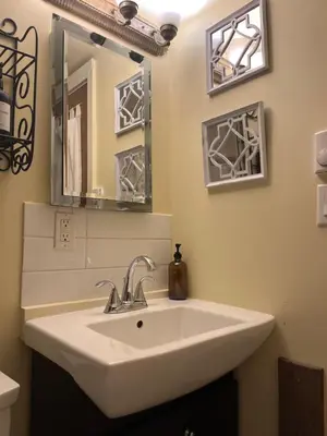 a bathroom with a sink and a mirror at Wildflower Suite in Whistler