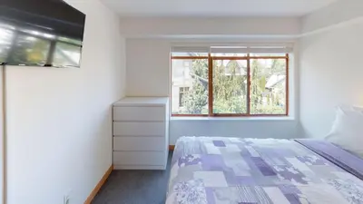 a bedroom with a bed and a window at Stoney Creek Northstar by Whistler Premier in Whistler