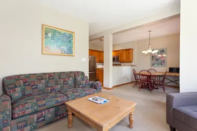 a living room with a couch and a table at Painted Cliff by Whistler Premier in Whistler