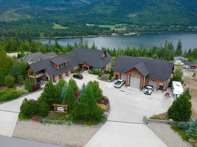 an aerial view of a large house with a driveway at Kootenay Wild Guest Suites in Nelson