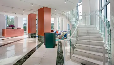 a lobby with a staircase in a building at Versante Hotel in Richmond