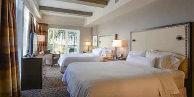 a hotel room with two beds and a window at Fairways Hotel on the Mountain in Victoria