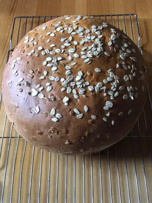 a chocolate cake with almonds on a cooling rack at Vines and Puppies Glamping Hideaway in Jade City