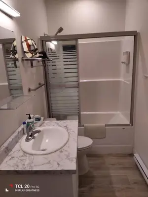 a bathroom with a sink and a shower and a toilet at Sweet House B&B in Victoria