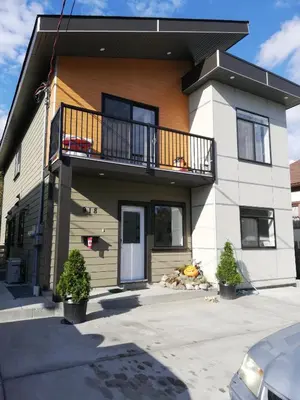 a house with a balcony on top of it at Sweet House B&B in Victoria
