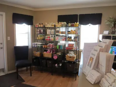 a room with a shelf filled with products at Village Creek Country Inn in Westerose