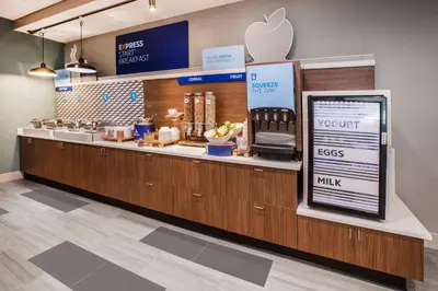an apple store with a counter with an appleasteryasteryasteryasteryasteryasteryastery at Holiday Inn Express & Suites - Calgary Airport Trail NE by IHG in Calgary