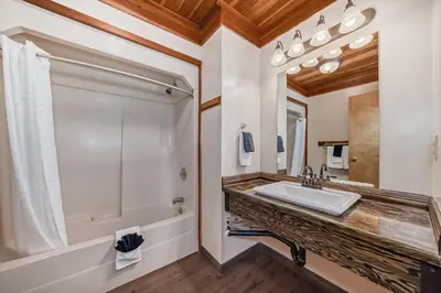 a bathroom with a sink and a shower at Terracana Ranch Resort in Tete Jaune Cache