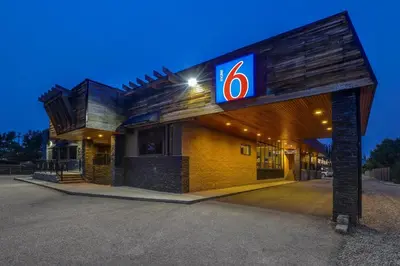 a gas station with a number sign on it at Motel 6 Brooks AB in Brooks