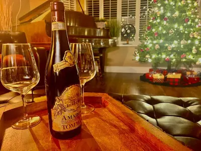 a bottle of wine sitting on a table with two wine glasses at Corkscrew Willow Estate in Vancouver