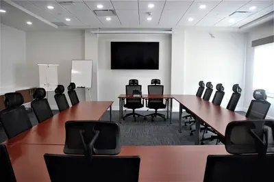 a conference room with a long table and chairs at Holiday Inn Express & Suites - Edmonton SW – Windermere by IHG in Edmonton