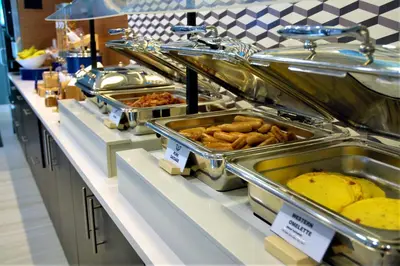 a buffet line with many different types of food at Holiday Inn Express & Suites - Edmonton SW – Windermere by IHG in Edmonton