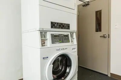 a washer and dryer in a laundry room at Holiday Inn Express & Suites Edmonton N - St Albert by IHG in St. Albert