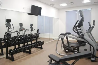 a gym with several tread machines in a room at Holiday Inn Express & Suites Edmonton N - St Albert by IHG in St. Albert