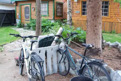 two bikes parked in front of a house at Nice Bunk Bed in Whitehorse