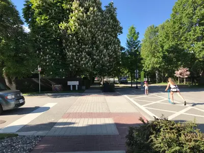 two girls playing a game in a parking lot at Stirling House in Kelowna