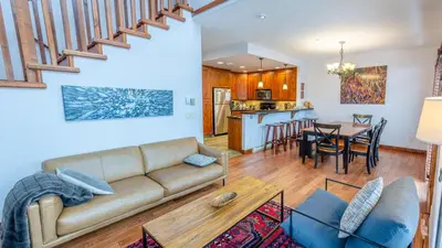 a living room with a couch and a table at Woodhaven #11 by Bear Country in Sun Peaks