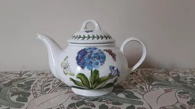 a tea pot sitting on top of a table at Sea Birds Cottage in Victoria