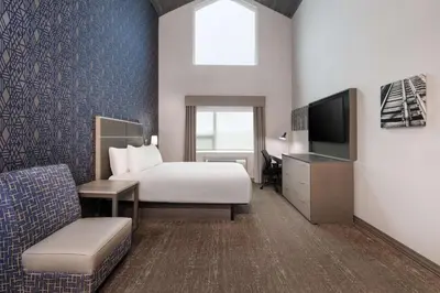 a hotel room with a bed and a television at Best Western Plus Prince George in Prince George