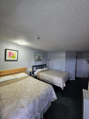 a hotel room with two beds in a room at Bio Vista Motel in Wainwright