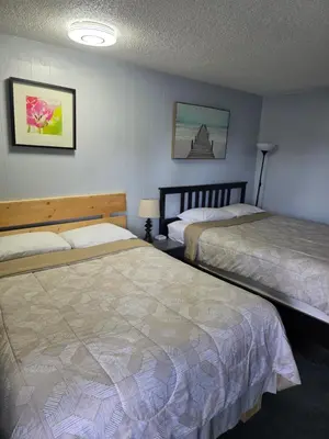 a hotel room with two beds in a room at Bio Vista Motel in Wainwright