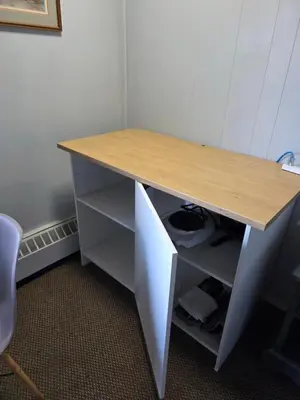 a desk with a wooden top and a shelf at Bio Vista Motel in Wainwright