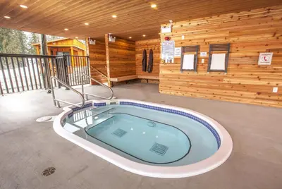 a jacuzzi tub in the middle of a building at Boulder Mountain Resort in Revelstoke
