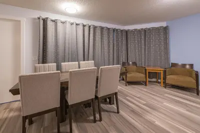 a dining room with a table and chairs at Luxurious One Bedroom Suite for a Larger Family 162 in Canmore