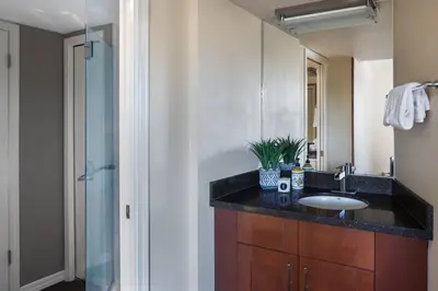 a bathroom with a sink and a shower at Mountain View Penthouse- 2BR Oasis at the Marquise in Whistler in Whistler