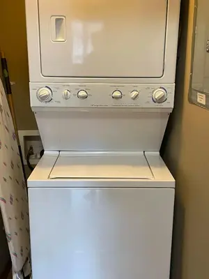 a white washer and dryer in a room at Rundle Rise - Spacious Condo Steps from Main Street in Canmore