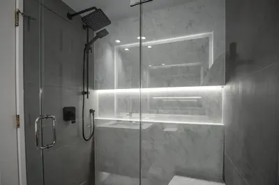 a bathroom with a shower with a glass door at 1BR in Northstar, Village Location, Gas Fireplace, Shared Hot Tub, Ski Storage in Whistler