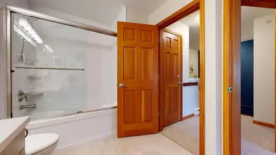 a bathroom with a shower and a toilet and a tub at 2BR in Northstar, Whistler Village, Fireplace, Hot Tub, Central Location, Ski Storage in Whistler