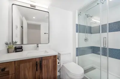 a bathroom with a shower and a toilet and a sink at 3BR in Foxglove, Wood Burning Fireplace, Mudroom, Near Gondola, Parking in Whistler